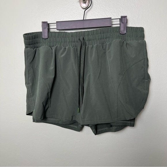 Avia Pants - Avia running shorts in olive green, size L (12-14)